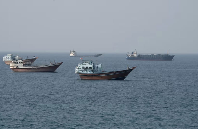 Vessels near the Strait of Hormuz, as seen from Musandam, Oman, August 17, 2026. 