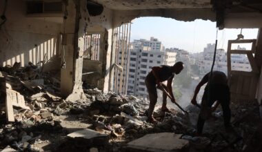 Palestinian residential salvage what they can from an apartment targeted in overnight Israeli airstrikes in Gaza City on Sunday.