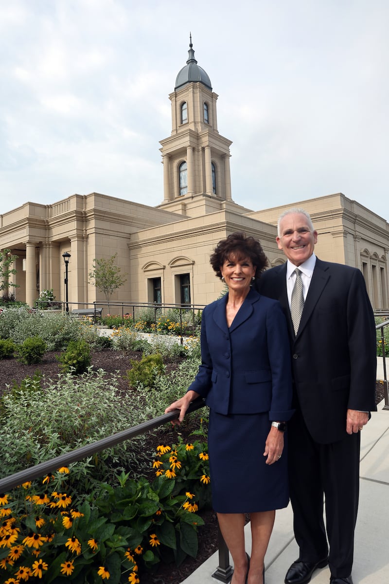 Bryan Laubaugh and Robin Laubaugh, Cleveland Ohio Temple open house and dedication coordinators, pause for a photo outside the Cleveland Ohio Temple on Saturday, Aug. 15, 2026.