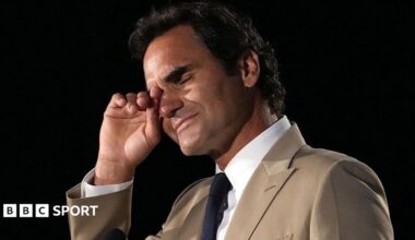 Roger Federer wipes away tears during his induction into the International Tennis Hall of Fame