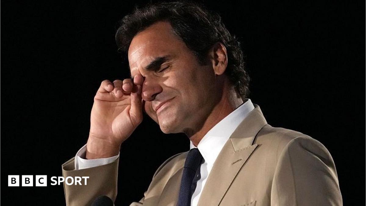 Roger Federer wipes away tears during his induction into the International Tennis Hall of Fame