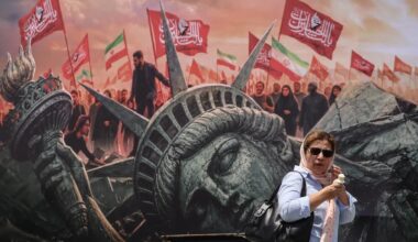 An Iranian woman walks past an anti-US billboard at Enghelab Square in central Tehran on August 3, 2026. (AFP).jpg