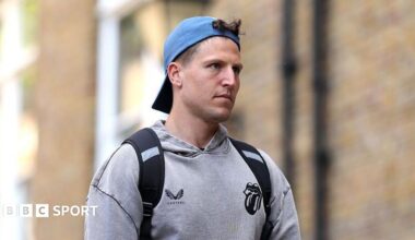 Brydon Carse, wearing a grey hoodie and backwards blue cap