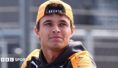 Lando Norris, in McLaren kit, pictured wearing a cap turned around backwards before the 2026 Dutch Grand Prix