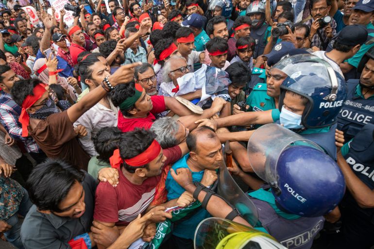 Activists clash with the police during a march in Dhaka, Bangladesh, on Tuesday, July 30, 2024