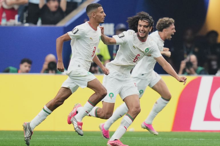 Morocco's Azzedine Ounahi, left, celebrates scoring his side's opening goal with Ayyoub Bouaddi during the World Cup round of 16 soccer match between Canada and Morocco in Houston, Saturday, July 4, 2026. (AP Photo/Eric Gay)