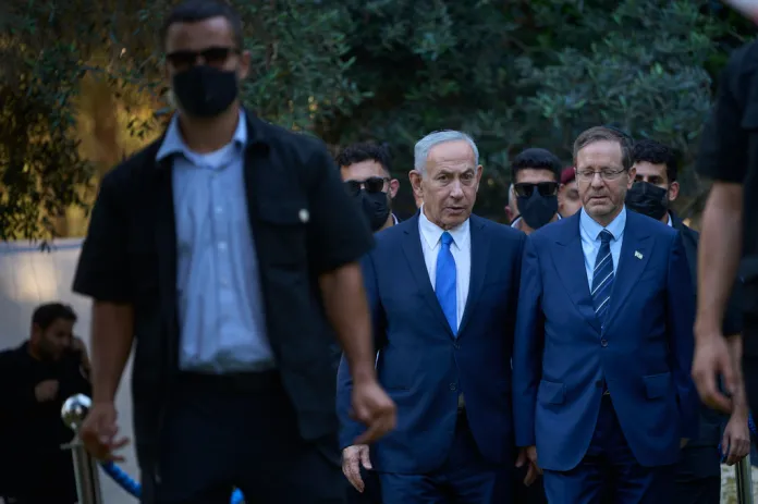 Israeli Prime Minister Benjamin Netanyahu, center, walks with President Isaac Herzog, at the state memorial for Ze'ev Jabotinsky, at Mount Herzl Military Cemetery in Jerusalem, Tuesday, July 14, 2026.