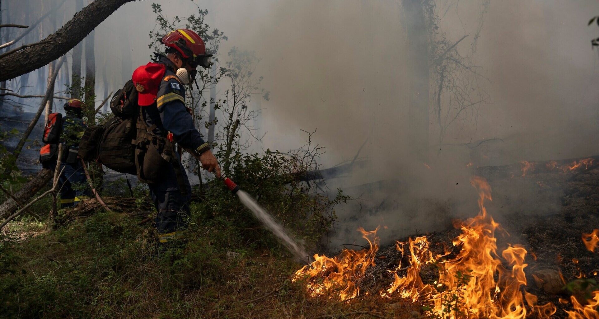 Firefighters in Greece struggle to save coastal resort as winds rage