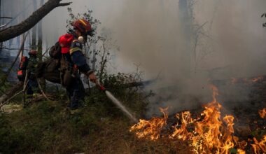 Firefighters in Greece struggle to save coastal resort as winds rage
