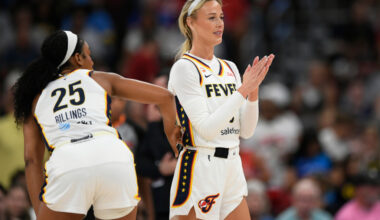 Indiana Fever's Sophie Cunningham claps as Chicago Sky's DiJonai Carrington is ejected from the game after committing a flagrant foul against her during the first half of an WNBA basketball game in Chicago, Saturday, Aug. 8, 2026. (AP Photo/Paul Beaty)