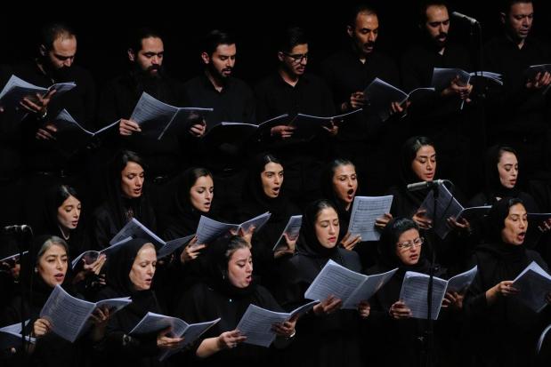 A choir performs in a Tehran Symphony Orchestra performance.
