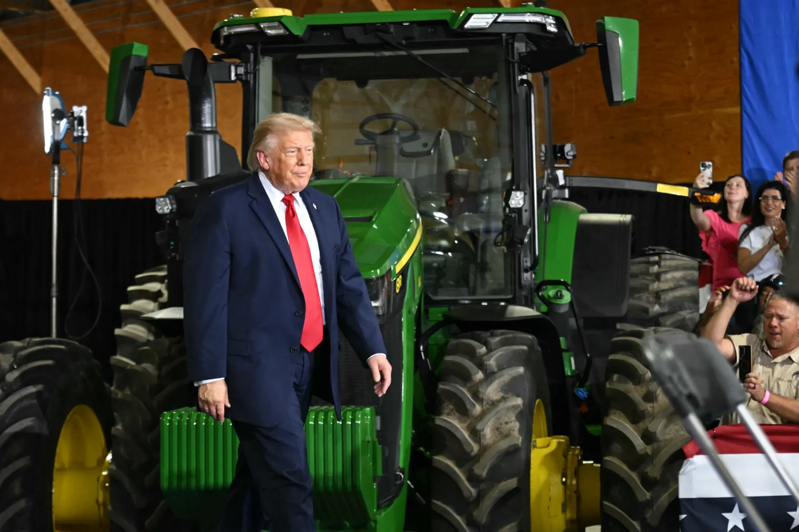 US President Donald Trump is applauded as he arrives to participate in a roundtable on "American Agriculture" at Custer Farms in Chippewa Falls, Wisconsin, on June 5, 2026.