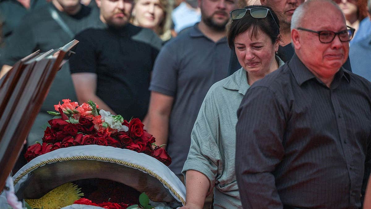 Family and villagers mourn community head killed in the Russian drone strike in Kyiv region