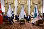 Turkey's Foreign Minister Hakan fidan, Pakistan's Foreign Minister Ishaq Dar, Egypt's Foreign Minister Badr Abdel Ati, and Saudi Foreign Minister Faisal bin Farhan pose for a picture ahead of a meeting in Cairo on June 21, 2026.