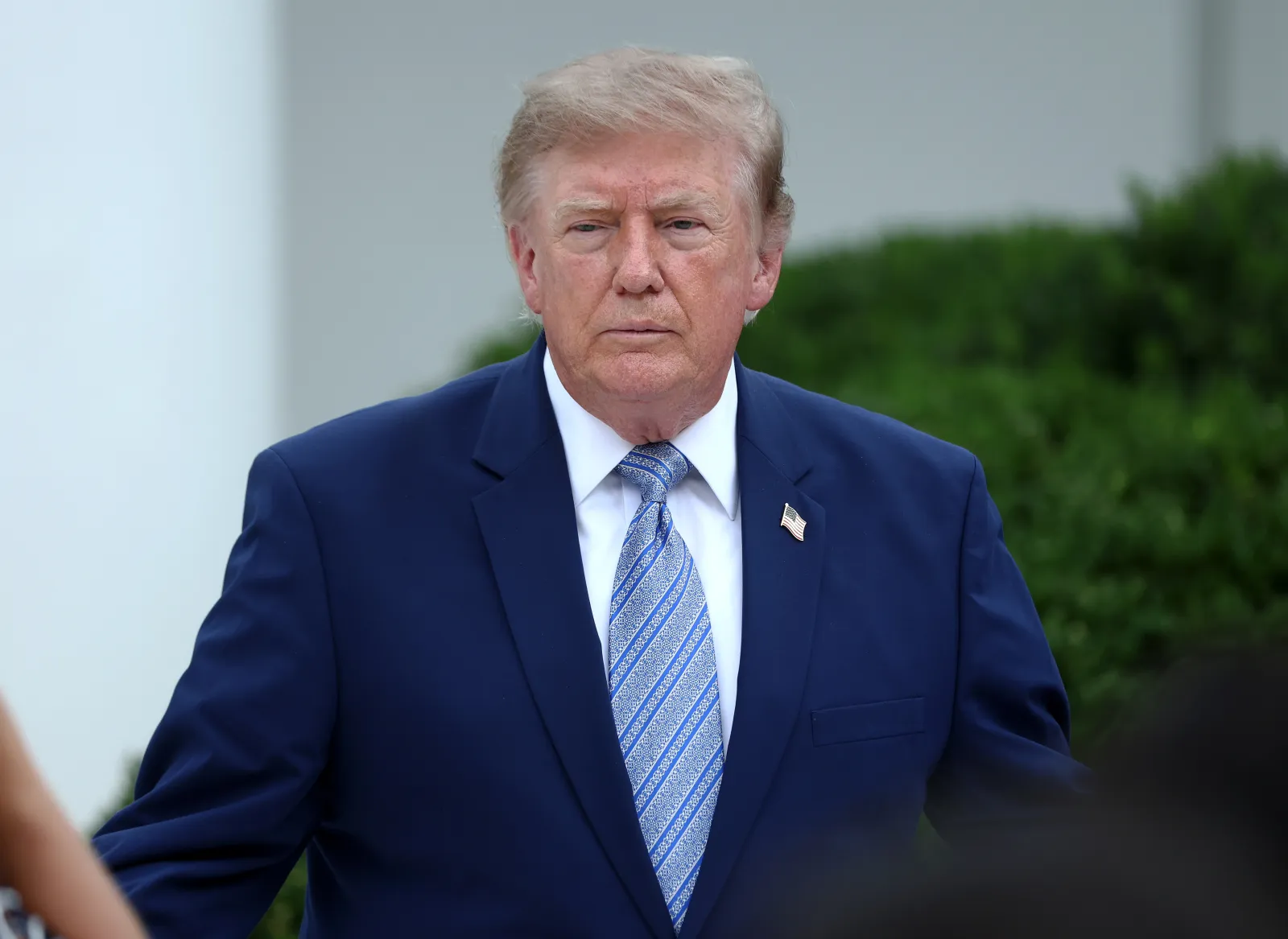 President Donald Trump (C) in the Rose Garden of the White House on August 20, 2026 in Washington, DC.