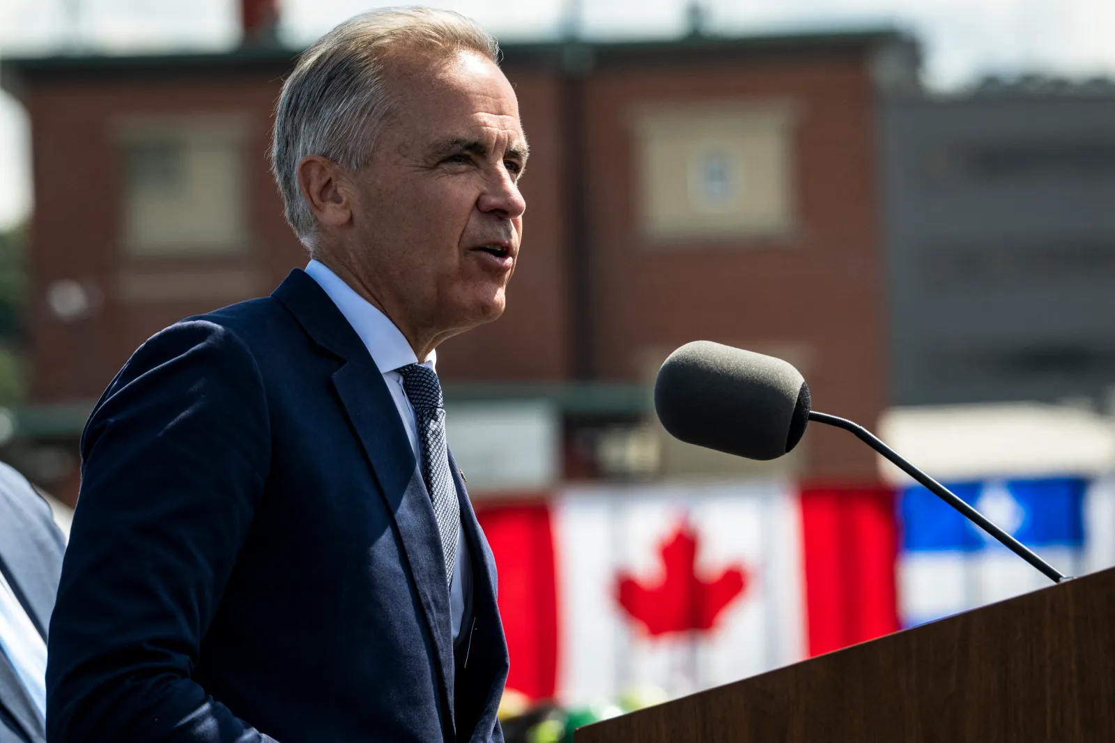 Canadian Prime Minister Mark Carney speaks about the trade dispute with the United States at the Davie Shipyard in Levis, Quebec, Canada on August 24, 2026. The administration of US President Donald Trump warned on August 23 that Canada would be "foolish" to think it could win a trade war with the United States, predicting a "devastating" impact on its northern neighbor. Negotiations between Washington and Ottawa broke down late August 22, putting into force new 50-percent US tariffs impacting about $20 billion worth of Canadian goods, or 5.5 percent of Canadian exports to the US. Canada in retaliation said it would match US tariffs, with new levies notably targeting the US steel and dairy industries to take effect on September 8. (Photo by ANDREJ IVANOV / AFP via Getty Images)
