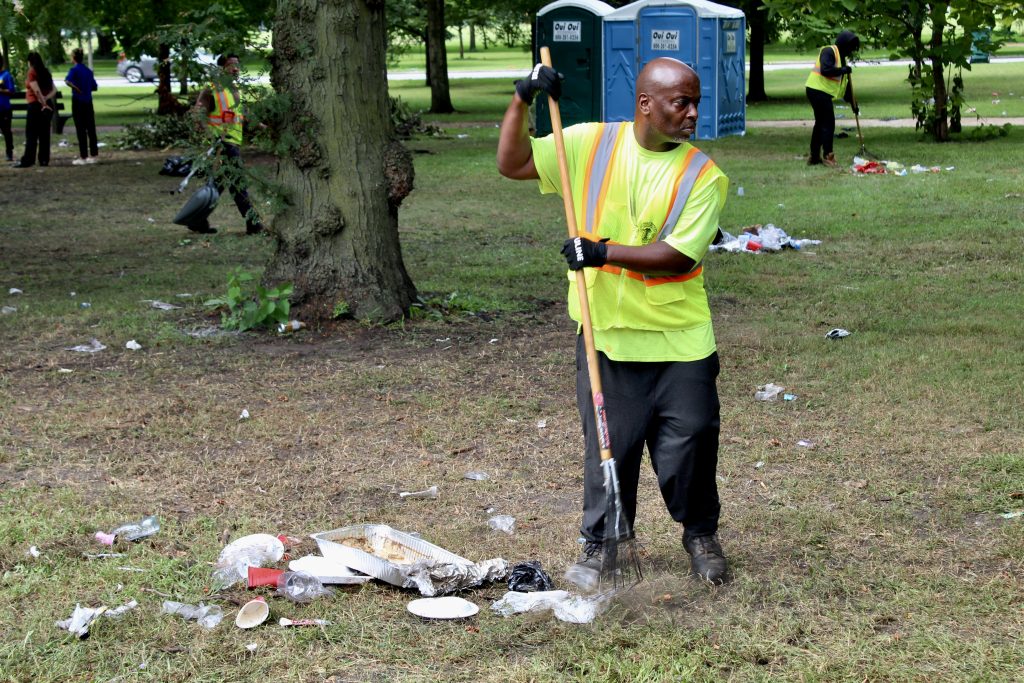 Chicago Park District c crews dispose of garbage at the aftermath of a mass shooting in Washington Park on Aug. 30, 2026.