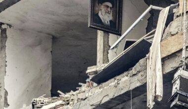Iranian women look at a building, which was damaged in a U.S. and Israeli strike in March, in Tehran, Iran, August 22, 2026.