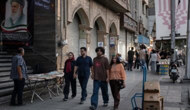 FILE — People walk along Enghelab street in the center of Iran's capital Tehran, July 7, 2026. President Trump’s replacement of a military war with a heightened economic one is not expected to alter Iran’s strategy, while further impoverishing its people.