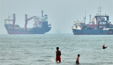 Cargo ship reports being struck in Strait of Hormuz as U.S., Iran claims about talks diverge