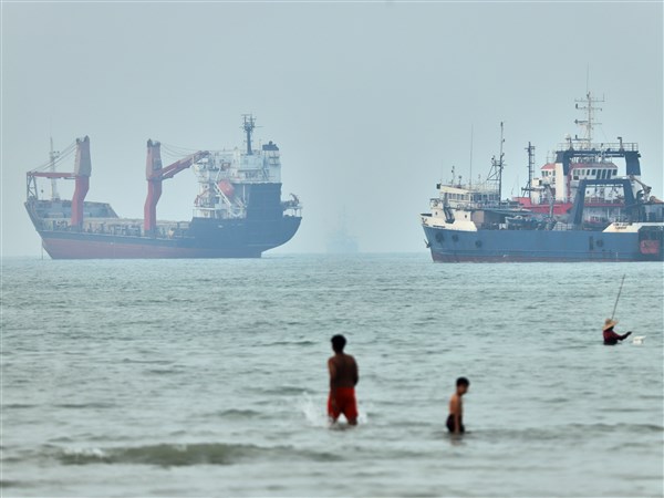 Cargo ship reports being struck in Strait of Hormuz as U.S., Iran claims about talks diverge
