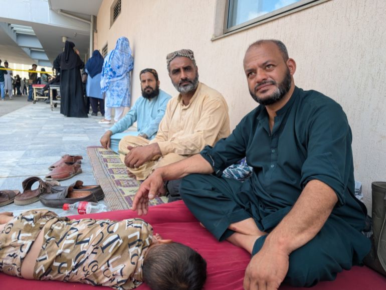 Arif Rana (right) sitting outside the maternity ward at PIMS on Wednesday, August 26, 2026
