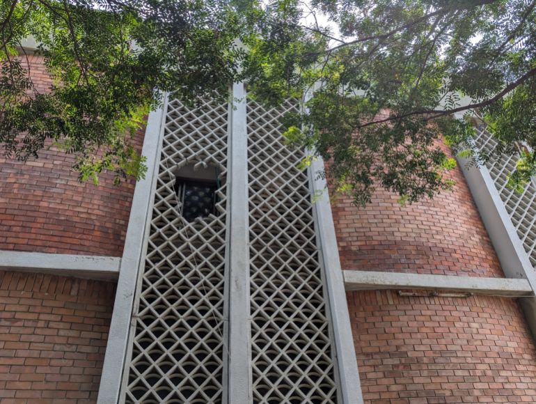 Rescue workers had to break the concrete grill, and then the window to gain access inside the ward to carry out rescue. [Abid Hussain/Al Jazeera]