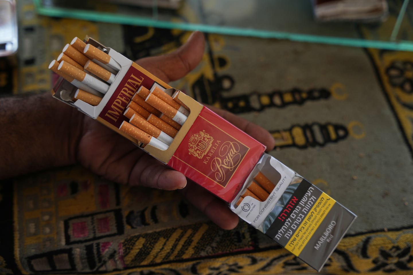 A vendor displayed packs of cigarettes at his kiosk in Deir al-Balah, central Gaza Strip, on Friday.