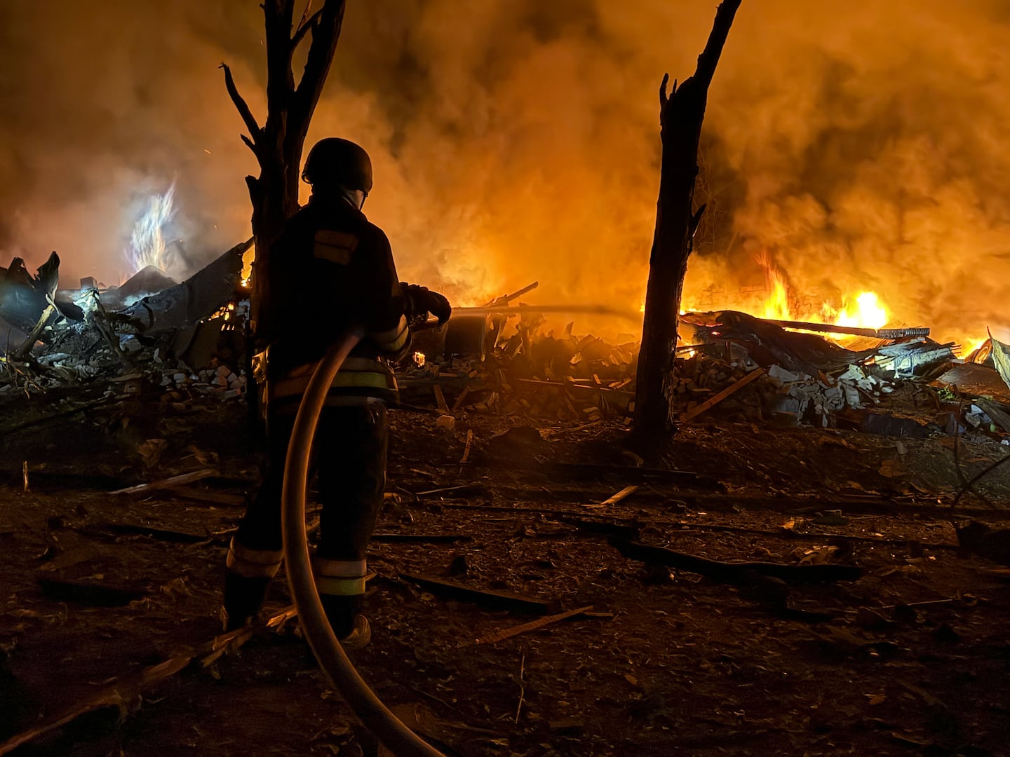 An Ukrainian rescuer works at the site of a Russian strike in Zaporizhzhia on August 11, 2026.