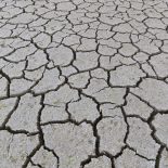 Abstract pattern of dry cracked clay mud in dried up lake bed / riverbed caused by prolonged drought in summer in hot weather temperatures. (Photo by: Sven-Erik Arndt/Arterra/Universal Images Group via Getty Images)