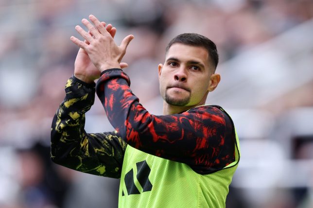 NEWCASTLE UPON TYNE, ENGLAND - APRIL 18: Bruno Guimaraes of Newcastle United applauds the fans as he warms up on the sideline during the Premier League match between Newcastle United and Bournemouth at St James' Park on April 18, 2026 in Newcastle upon Tyne, England. (Photo by Alex Livesey/Getty Images)