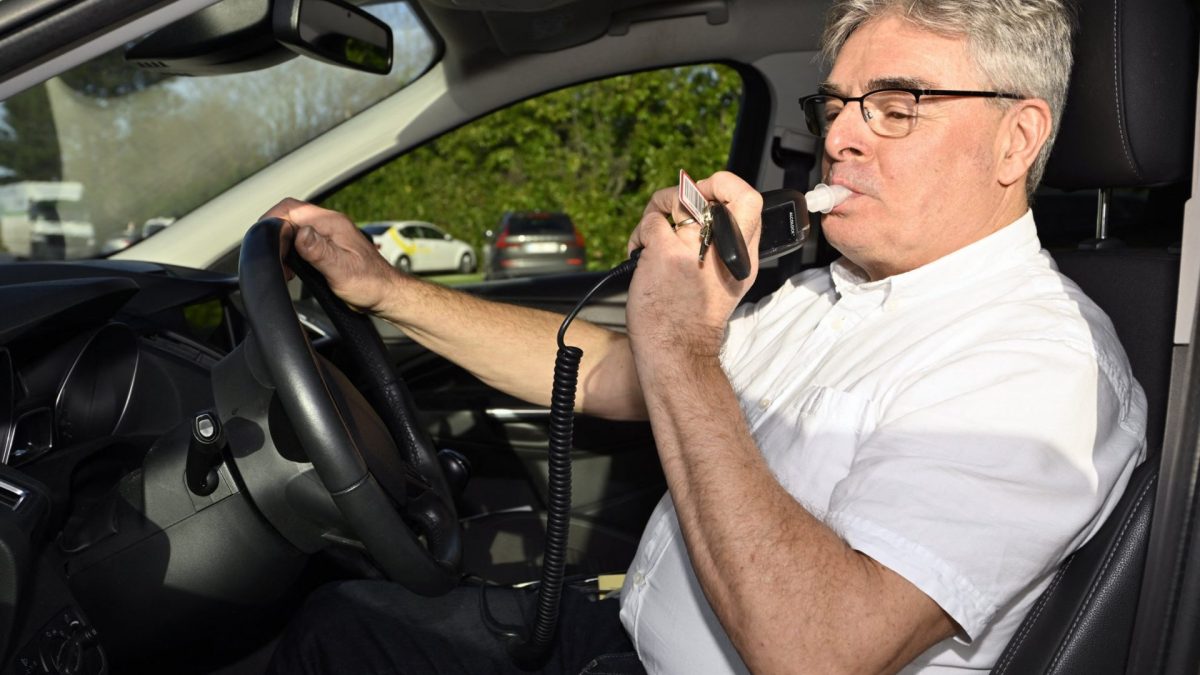A VIAS staff member gives a demonstration of an alcolock alcohol lock in cars, at the presentation of a study by VIAS institute on the efficiency of the alcolock alcohol lock in cars, in Brussels on January 11, 2023. (Photo by ERIC LALMAND / BELGA / AFP) / Belgium OUT (Photo by ERIC LALMAND/BELGA/AFP via Getty Images)