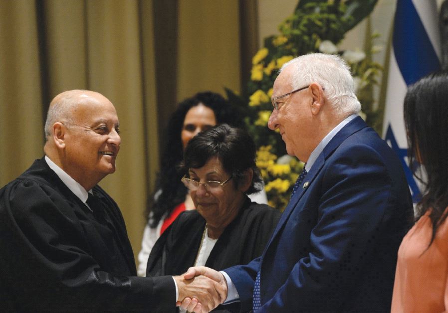 PRESIDENT REUVEN RIVLIN congratulates Supreme Court Deputy President Salim Joubran at his swearing-in ceremony yesterday, as the court’s president, Miriam Naor (center), and Justice Minister Ayelet Shaked stand by