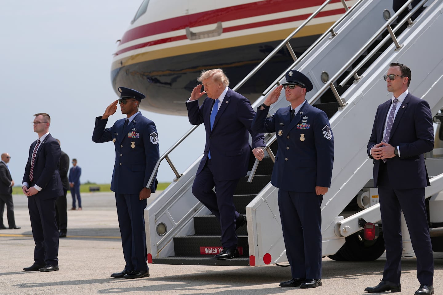 President Trump disembarked Air Force One at John F. Kennedy International Airport, on Friday.