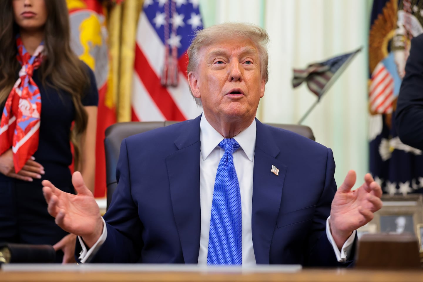 President Trump speaks to reporters during an event in the Oval Office.