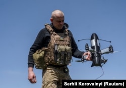 A Ukrainian soldier prepares an interceptor drone for launch near the front in Ukraine's Donetsk region. (file photo)