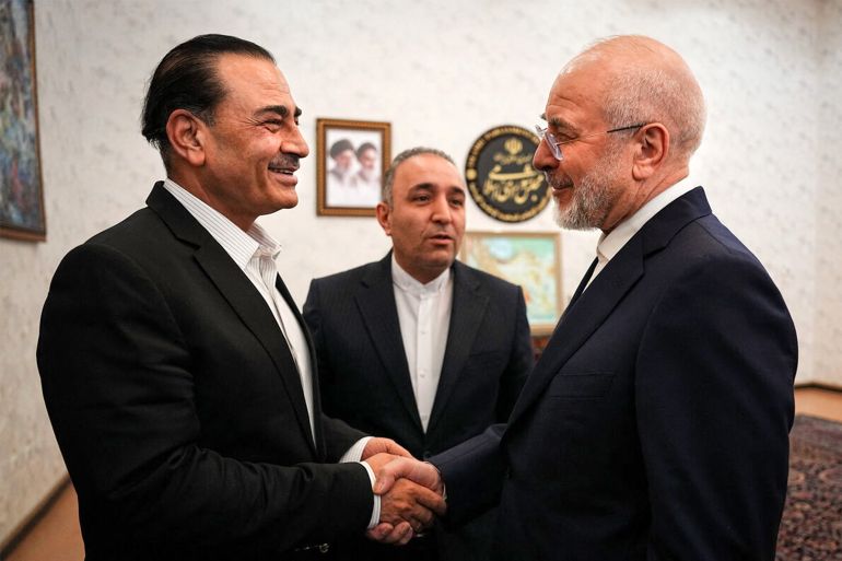 This handout picture provided by Iran’s parliament speaker’s office shows Speaker Mohammad Bagher Ghalibaf, right, receiving Pakistan’s army chief Field Marshall Asim Munir in Tehran on August 24, 2026 [AFP]