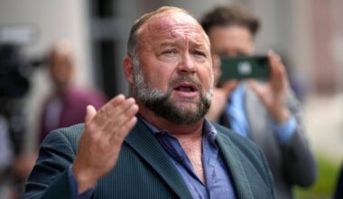 Right-wing conspiracy theorist Alex Jones speaks to the media after arriving at the federal courthouse for a hearing in front of a bankruptcy judge, June 14, 2024, in Houston. (AP Photo/David J. Phillip)