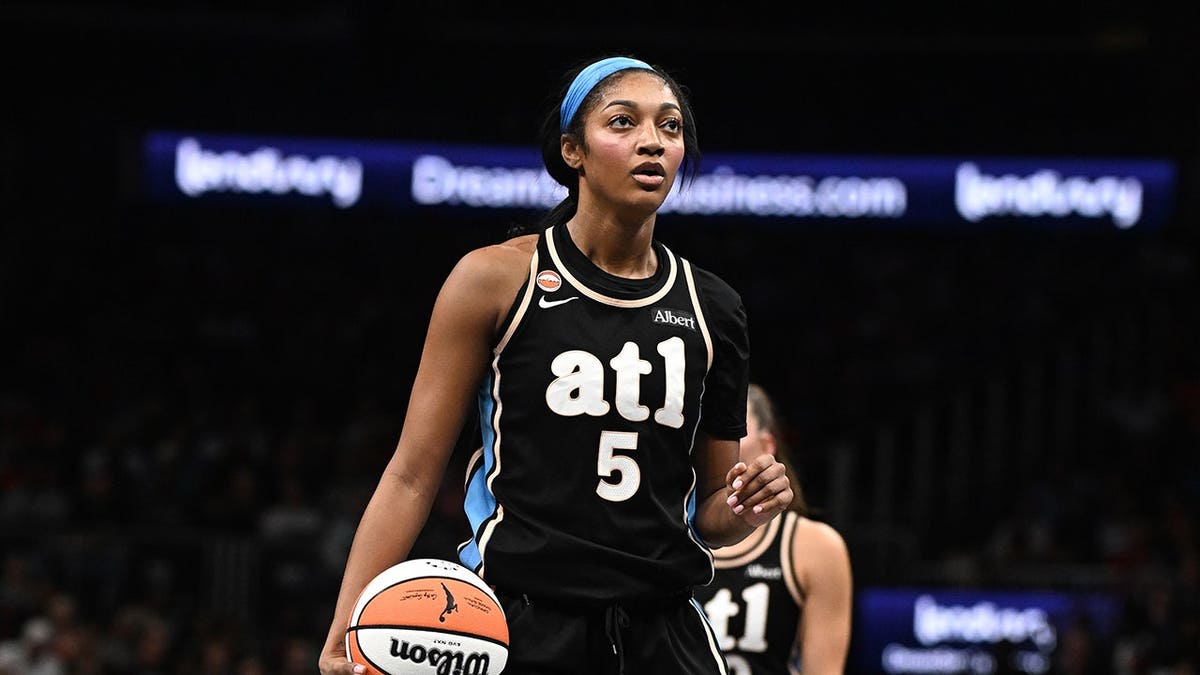 Angel Reese #5 prepares to shoot a free throw against the Indiana Fever.