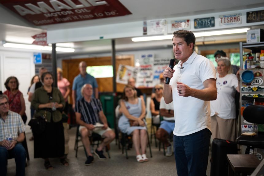 Rep. Seth Moulton talks with voters during an event in Chelmsford, Mass., on Sunday, August 16, 2026.