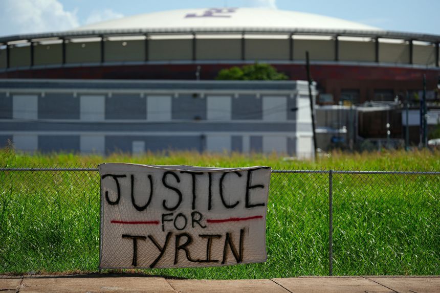 A banner for shooting victim Tyrin Johnson hangs July 17 near the corner of Union Avenue and Fourth Street in Memphis, Tennessee.