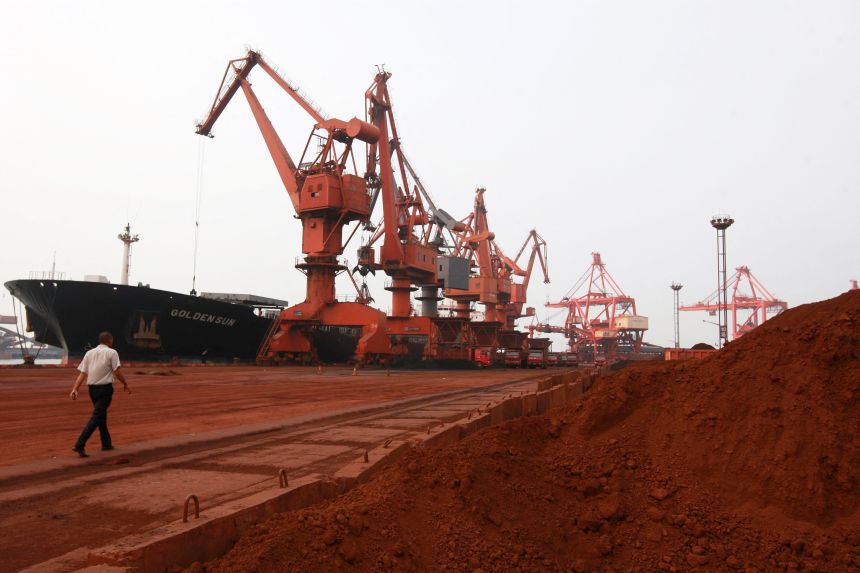 Bulldozer scoop soil containing various rare earth to be loaded on to a ship at a port in Lianyungang, east China's Jiangsu province in 2010, for export to Japan.
