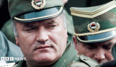 Bosnian Serb General Ratko Mladic leaves a meeting at the airport in Sarajevo, Bosnia and Herzegovina April 13, 1993. He is wearing a green and gold military peaked cap.