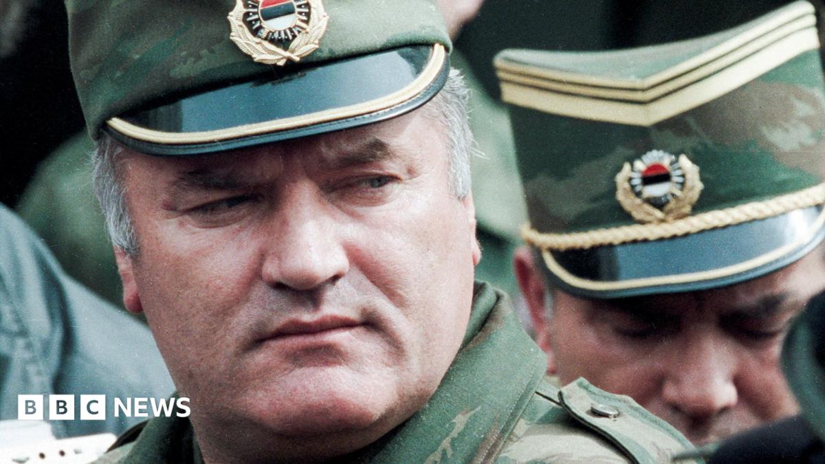 Bosnian Serb General Ratko Mladic leaves a meeting at the airport in Sarajevo, Bosnia and Herzegovina April 13, 1993. He is wearing a green and gold military peaked cap.