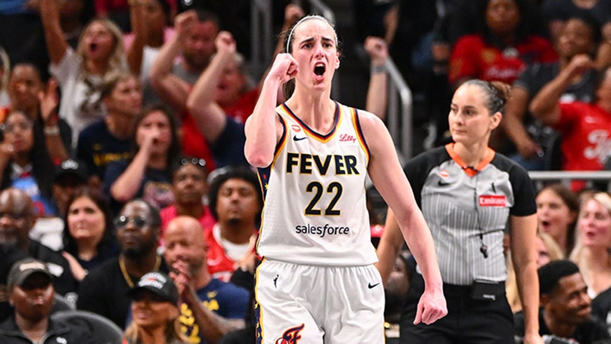 Caitlin Clark #22 celebrates during a game against the Atlanta Dream.