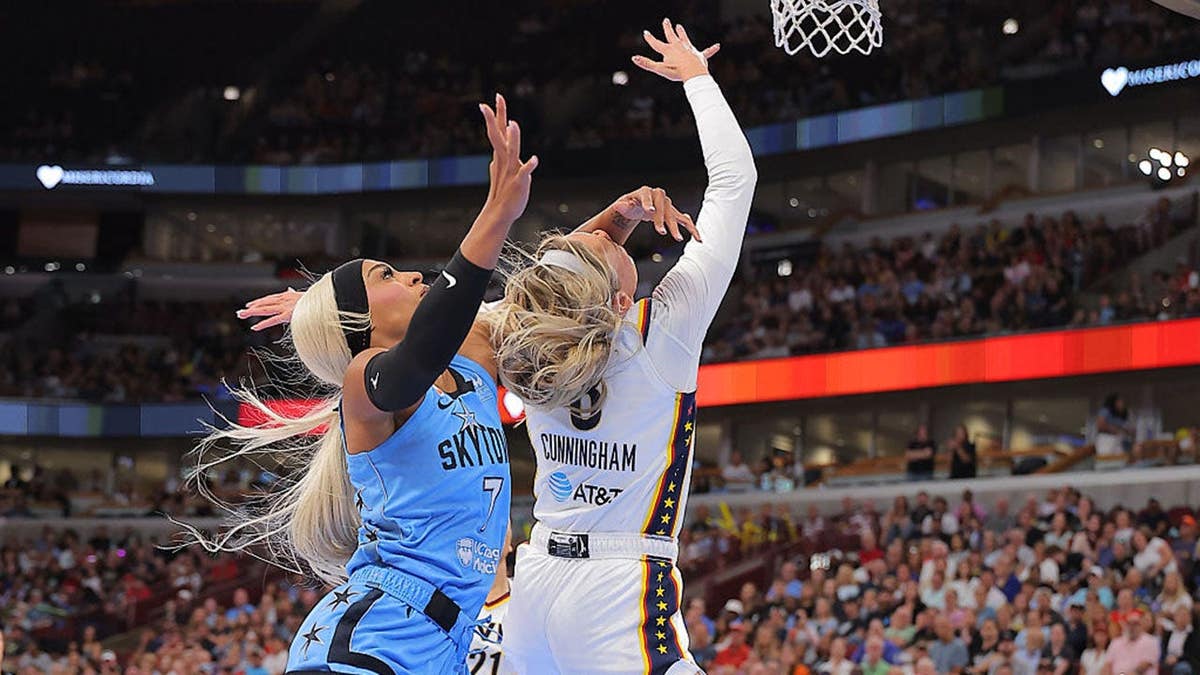 DiJonai Carrington fouls Sophie Cunningham during the first half at the United Center.