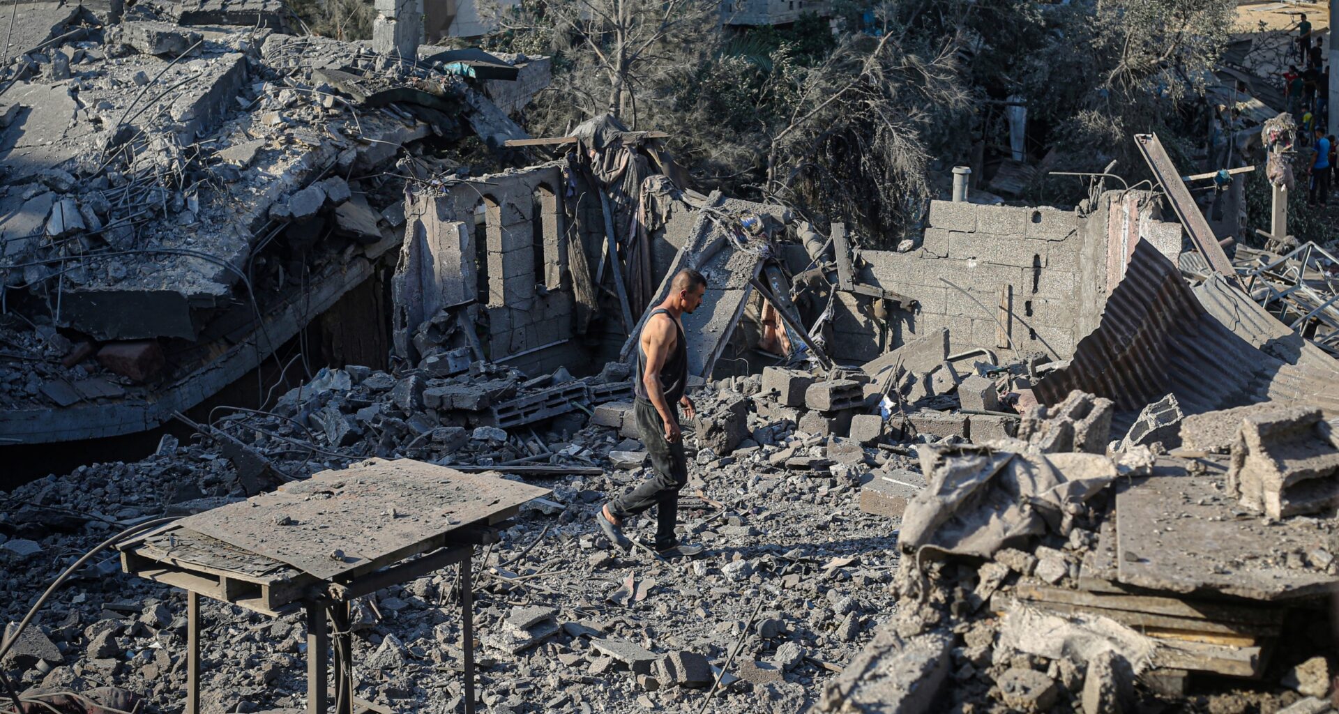 Displaced Man Walks Through Rubble In Deir Al-Balah