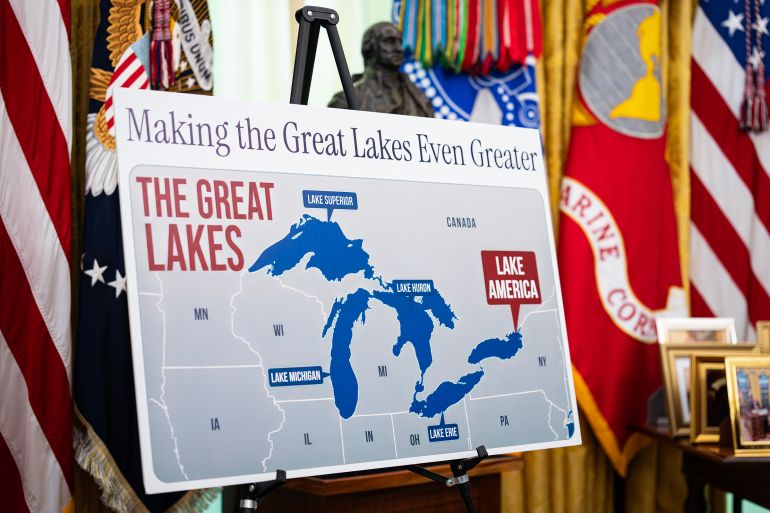 epa13195216 A poster shows the name change from Lake Ontario to Lake America, as US President Donald Trump signs an executive order on the renaming, amid a recent trade war, in the Oval Office of the White House in Washington, DC, USA, 27 August 2026. EPA/AL DRAGO / POOL