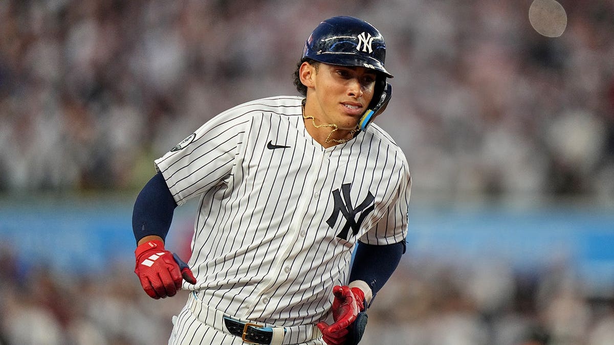 George Lombard Jr. runs the bases after hitting a home run.