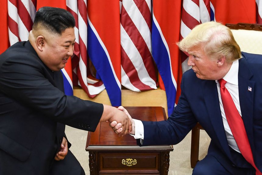 North Korean leader Kim Jong Un and US President Donald Trump shake hands during a meeting in the Joint Security Area of Panmunjom in the Demilitarized zone on June 30, 2019.